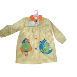 12 MANDILON DINO AMARILLO GARVEL. ROPA PARA BEBES ,PREMAMA Y COLEGIAL - COLEGIO ,MANDILONES, MOCHILAS CON BOTONES . TALLAS 4